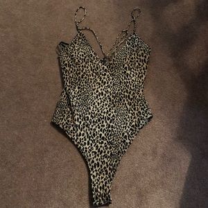 Cheetah print body suit.